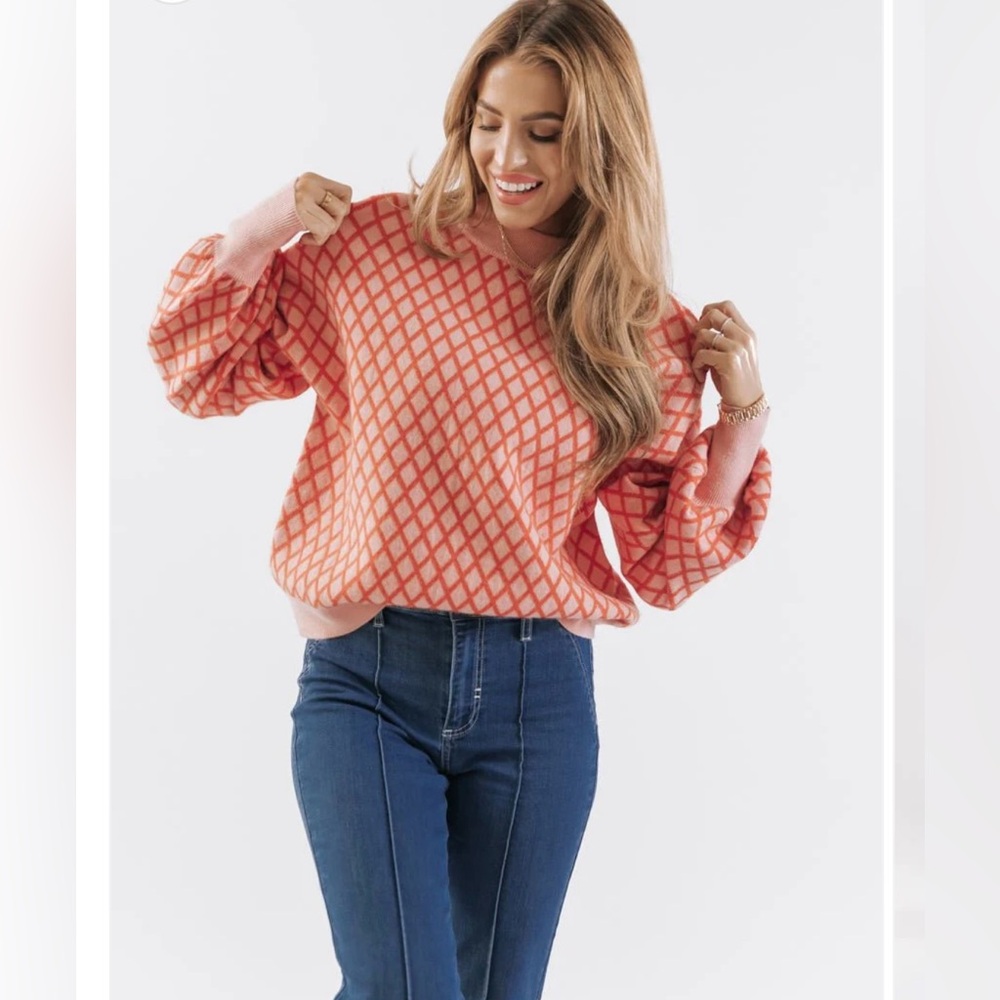 New without tags. Boutique sweater. Pink and red print. Size small. Never worn.